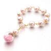 H2b3234003f5e48a0a76b09b34e23a6f2I Komi Wholesales Pink Glass Pearl Glass Star Sphere Religious Baby Baptism Rosary Bracelets