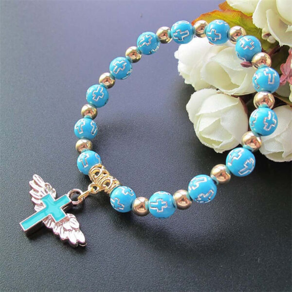 H2ef06394198b4388953c5410efcca83fZ KOMI Hot Sale Gilding Acrylic Cross Beaded Bracelets Enamel Angel Wing Cross Pendant Rosary Bracelet for Women Birthday Gifts